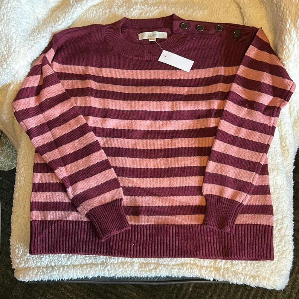 LOFT crewneck sweater with button detail on left shoulder.